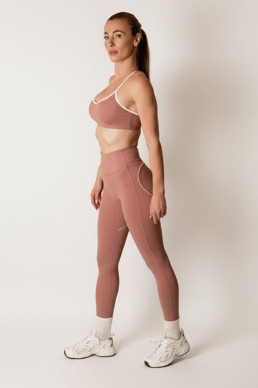 SQWT ContourHeart dusty pink high-waist leggings for women. White contour lines enhance glutes. Squat-proof fitness wear.