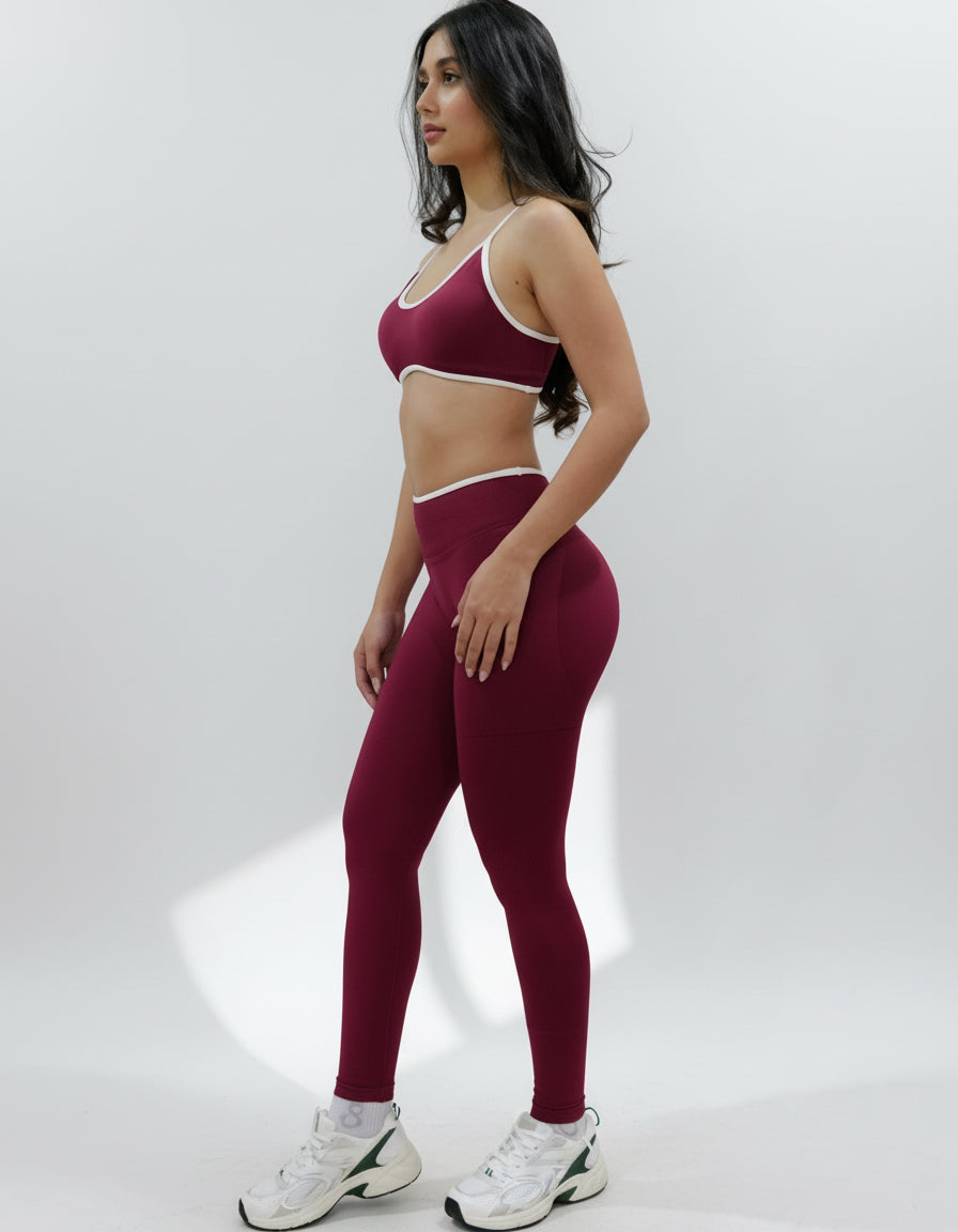 Red wine seamless leggings with white piping featuring a supportive high waist, invisible scrunch butt, and butt lifting compression, perfect for gym, squat proof workouts, and fitness.