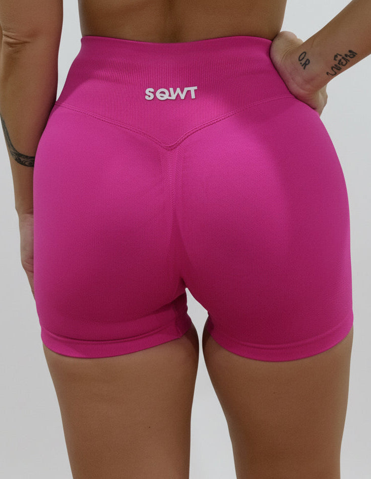 Fuchsia seamless high-waisted scrunch gym shorts with a V-shaped back waistband.