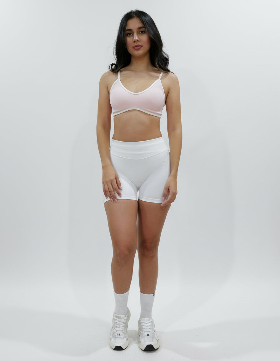 White seamless high-waisted scrunch gym shorts with a V-shaped back waistband.