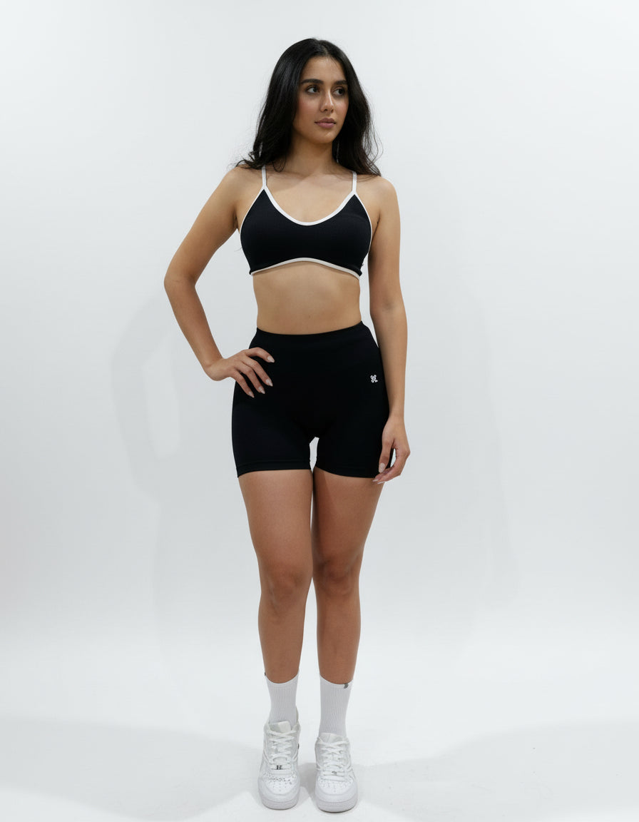 Black seamless high-waisted scrunch gym shorts with a V-shaped back waistband.