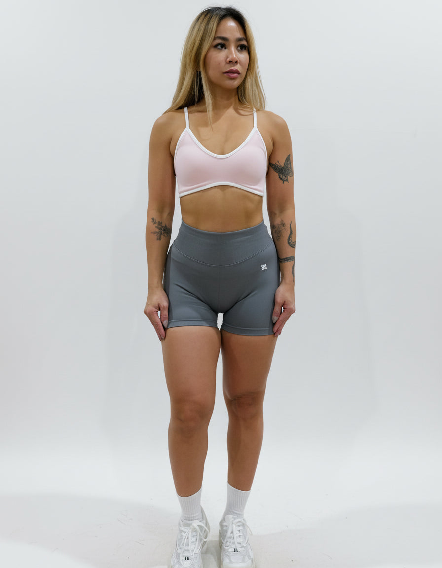 Dark grey seamless high-waisted scrunch gym shorts with a V-shaped back waistband.