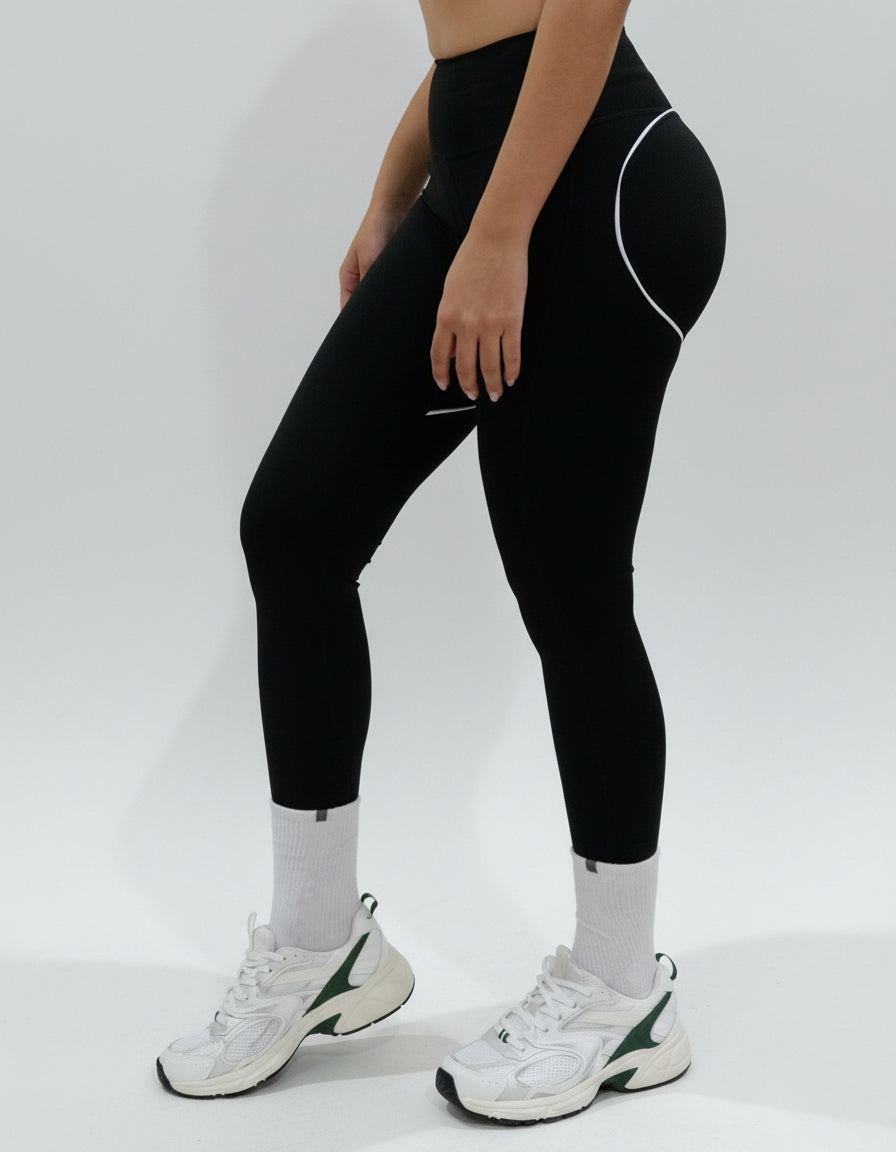 SQWT ContourHeart black high-waist leggings for women. White contour lines enhance glutes. Squat-proof fitness wear.